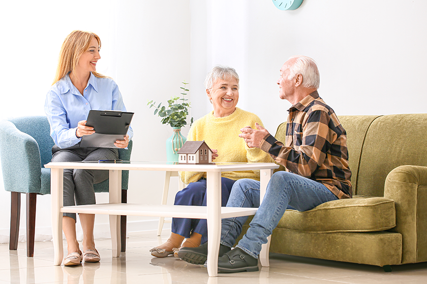 female-real-estate-agent-working-with-senior-couple