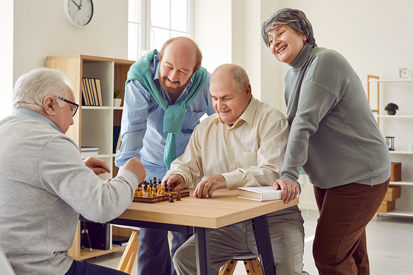 group-happy-diverse-senior-people-playing-chess